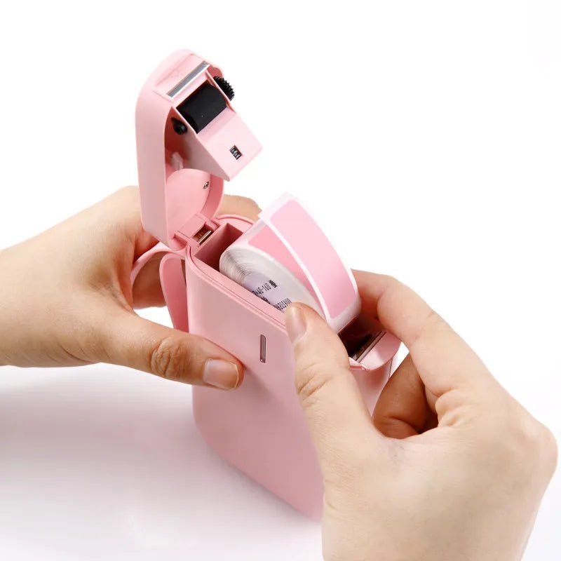 D11 Bluetooth thermal label printer in various colours, shown next to a mobile phone displaying the label design app.