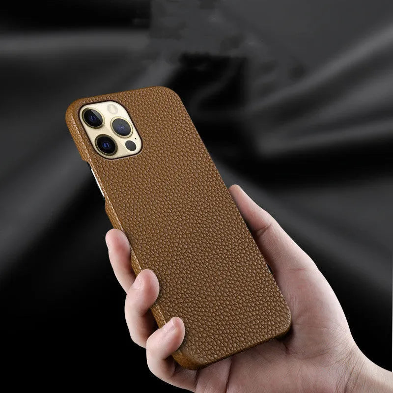Brown genuine leather half-wrap protective case on an iPhone 14 Pro Max.