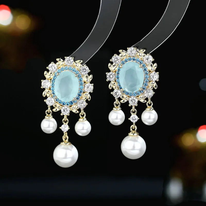 Oval geometric earrings with zircon inlay, pearl details and tassels in light purple, pink or white