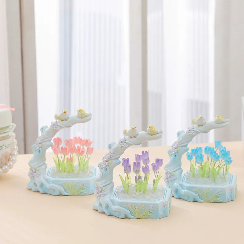 Resin tulip-shaped decorative night light assembled from DIY material package on a desk.