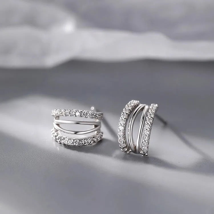 A pair of geometric-shaped 925 silver earrings with an electroplated finish, shown in large, medium, and small size options.