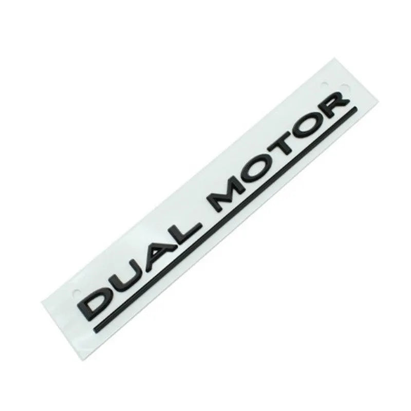 Tesla Model 3 dual motor performance sticker in black and red on a car bumper