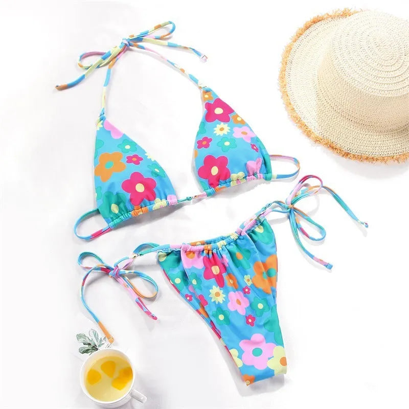 Women's polka dot print split bikini swimsuit in briefs and triangle styles on a mannequin
