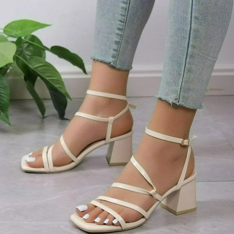 Plus size beige open toe slippers with square head and ankle buckle on a neutral background.