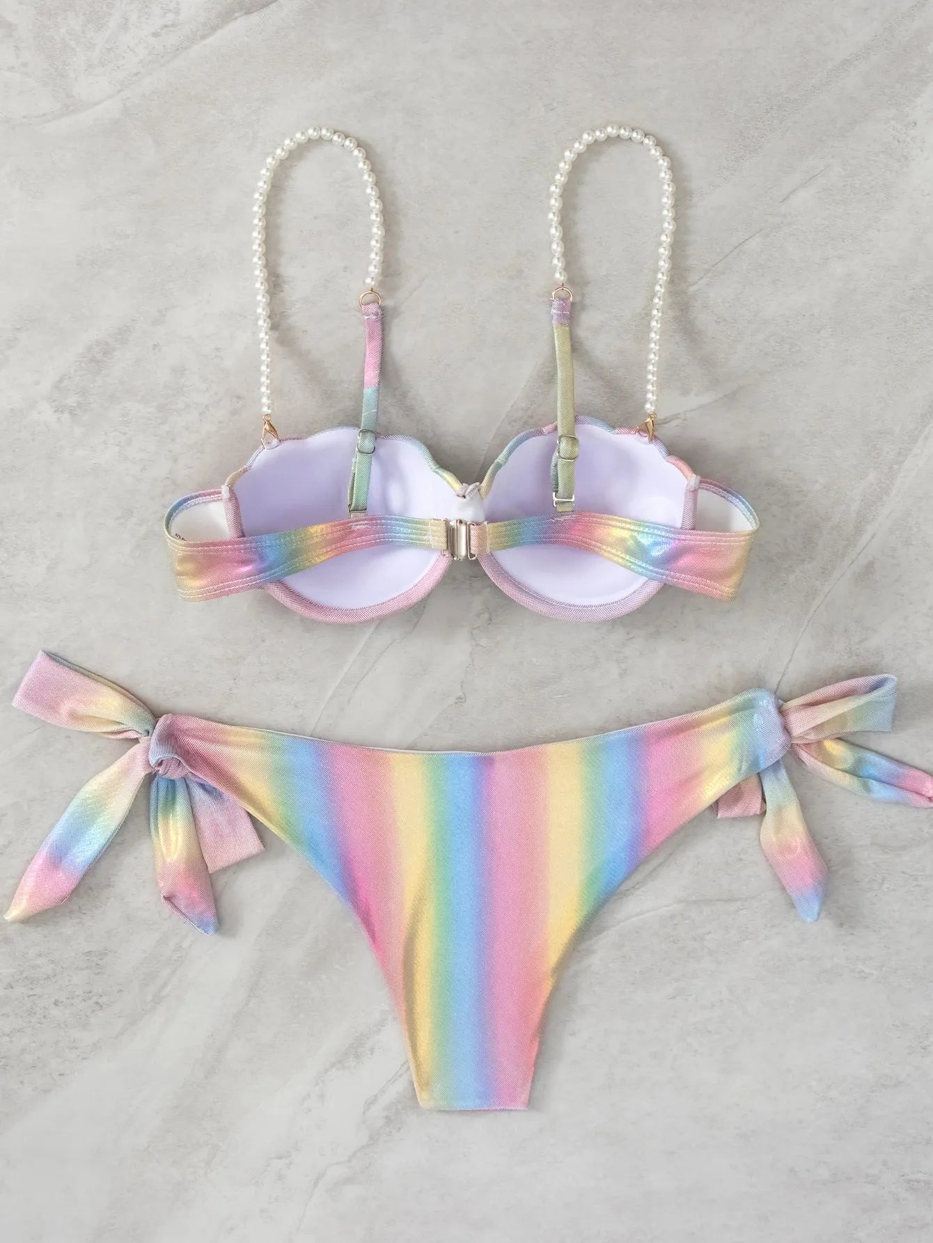Women's rainbow split tied bikini swimsuit made from polyester fabric.
