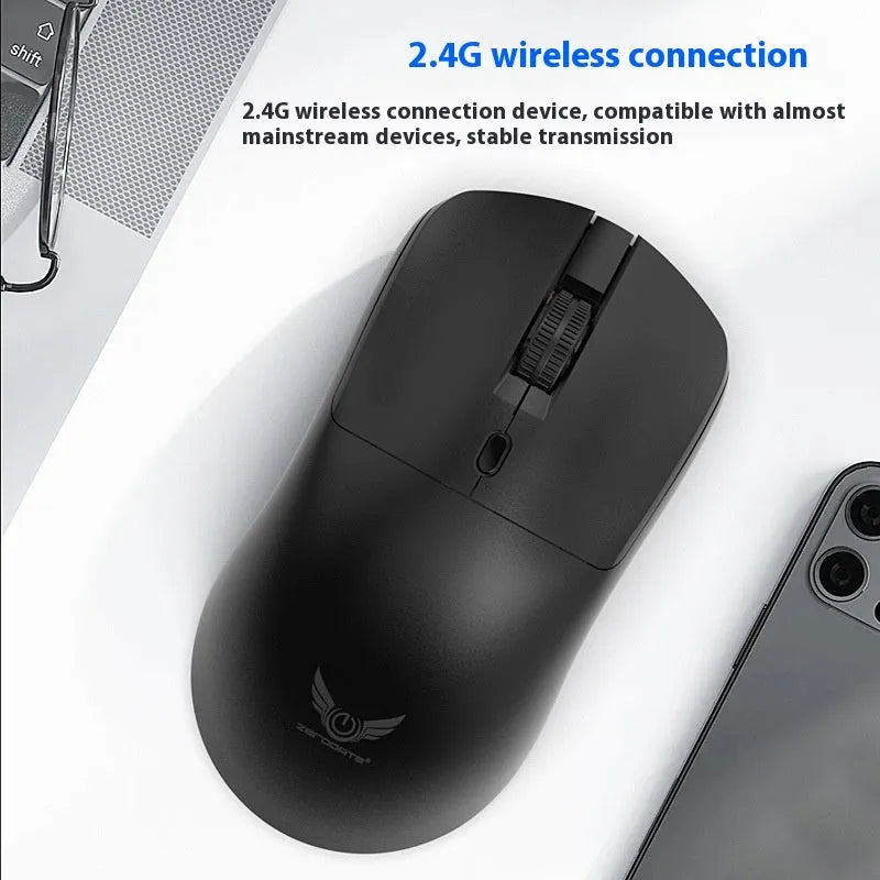 Black wireless mouse with three-gear audio buttons on a laptop desk setup