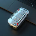 Carbon fibre style car key cover with mirror accent in carbon and white colour options
