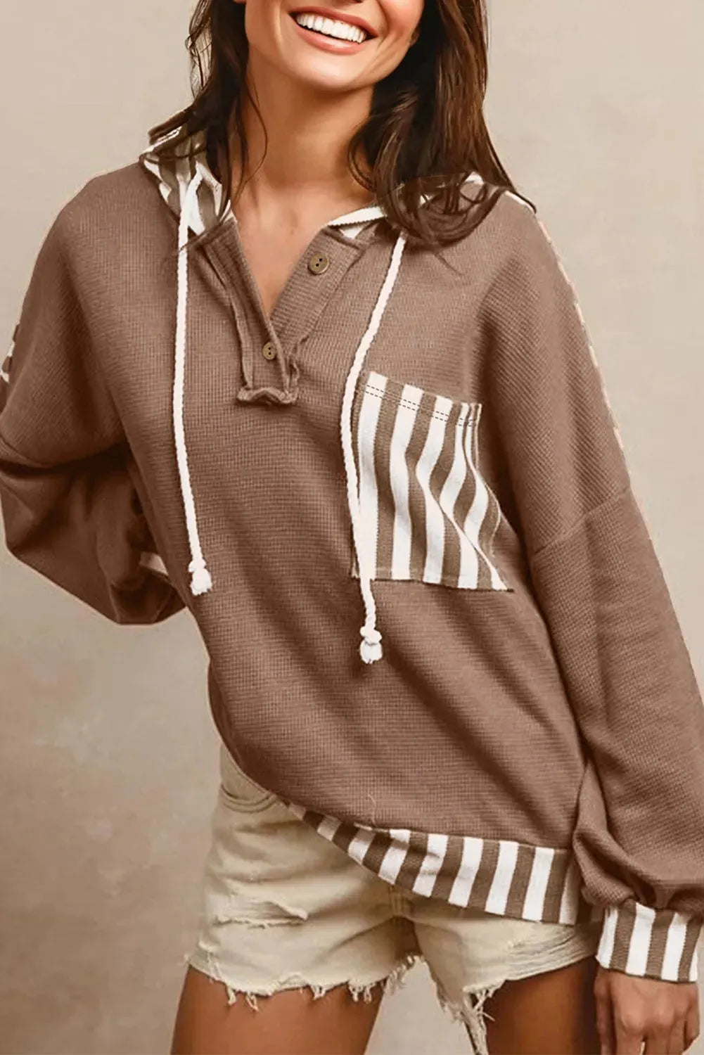 Straw yellow waffle texture hoodie with striped patchwork design and button neck