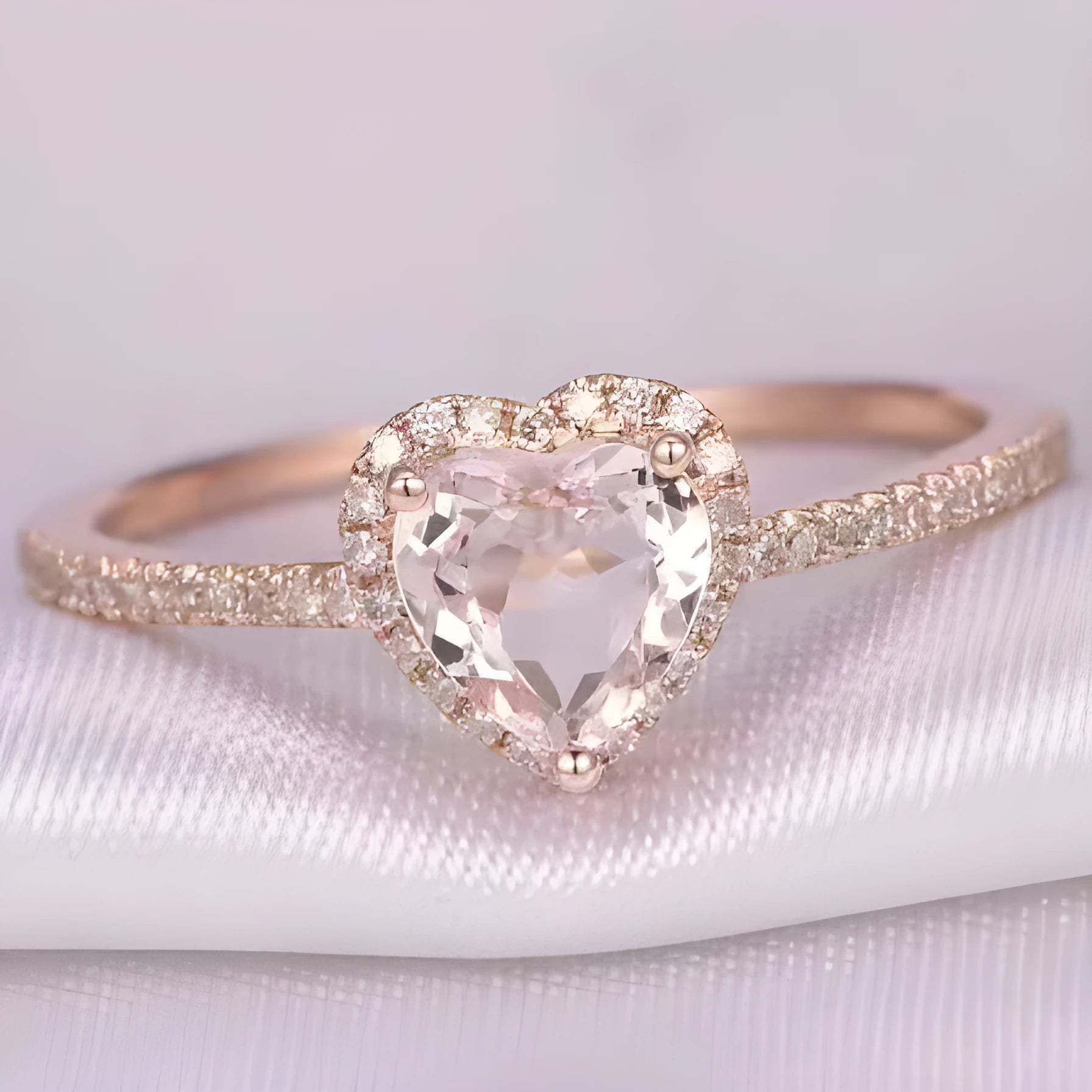 Heart-shaped women's fashion ring with crystal details in rose gold or silvery electroplated finish.