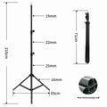 Tall black floor tripod stand holding a mobile phone extended to its full height on a wooden floor.