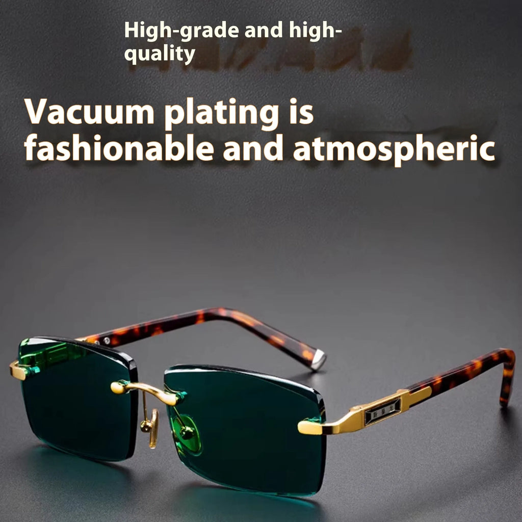 A pair of dark green frameless crystal sunglasses presented with a matching glasses case and a lens cloth.