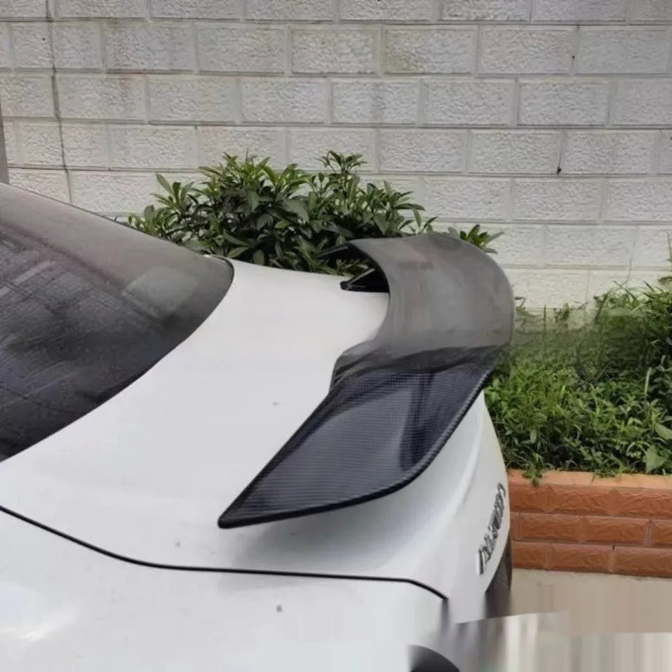 Universal punch-free car tail wing spoiler in ABS material showing four finish options