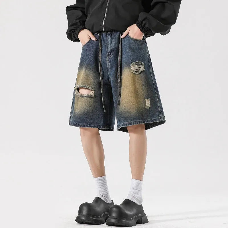 Retro blue loose fit ripped jeans with distressed detailing and street style design