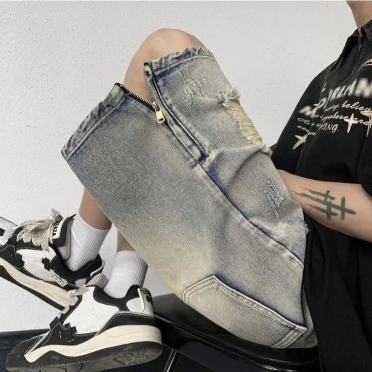 Blue retro tattered denim shorts with wide leg fit and distressed detailing