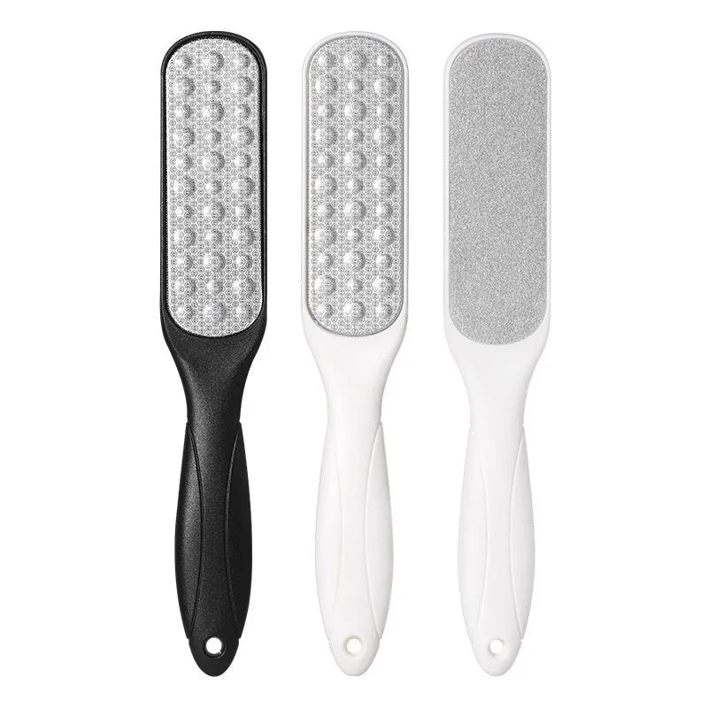 Stainless steel double-sided foot grinder with white and black abrasive heads for callus removal