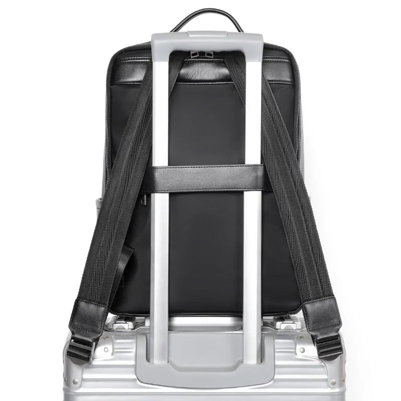 Men's black leather computer backpack with woven detailing and substantial 36-55 litre capacity