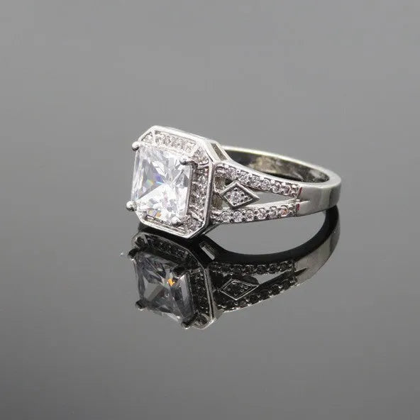Women's platinum-colour hollow geometric zircon ring on a copper band, shown in size 7.