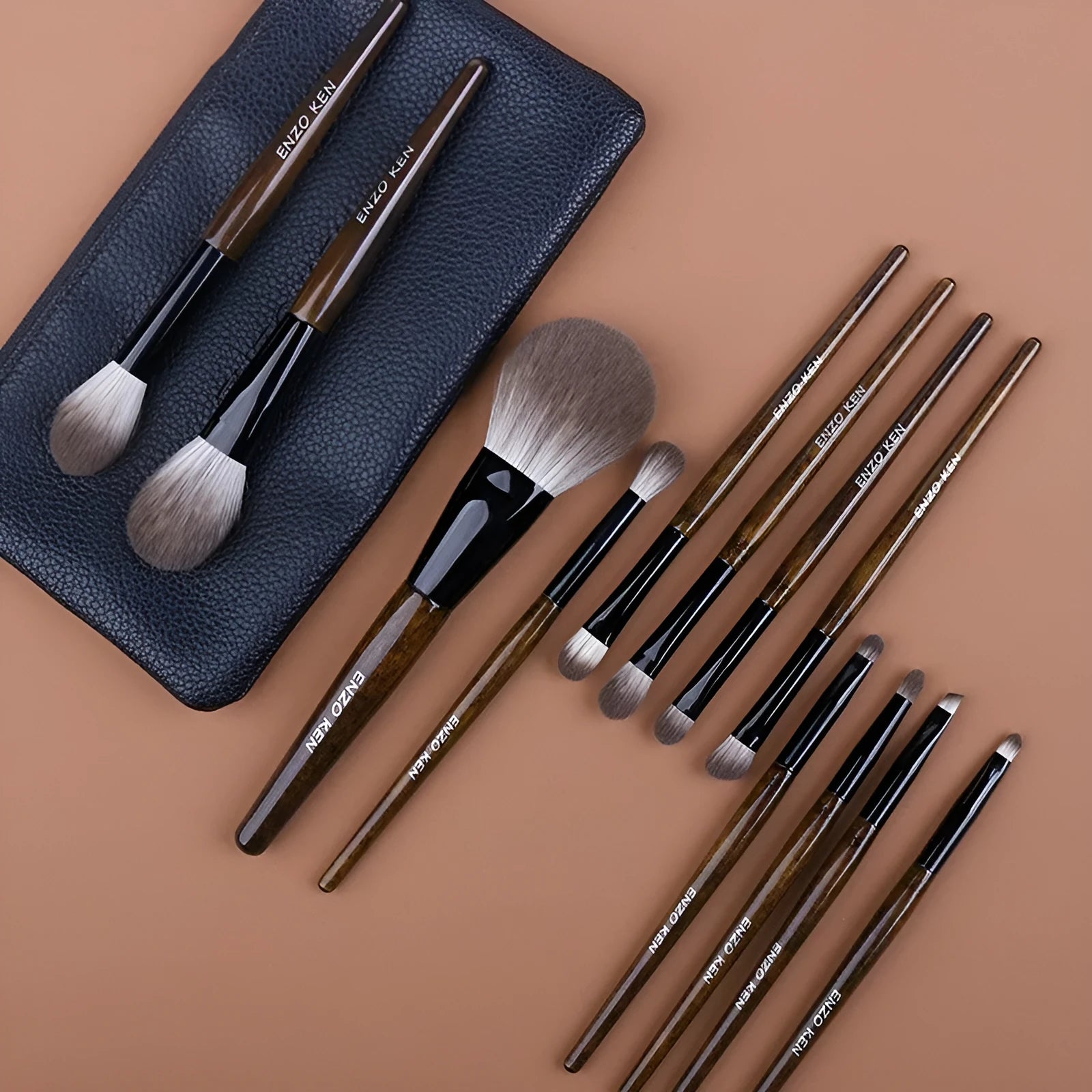 12-piece makeup brush set with wooden handles stored in black PU roll-up case