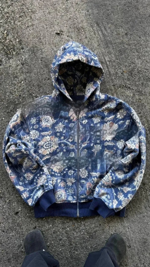 Man wearing a loose blue zip-up hooded coat for casual autumn wear.