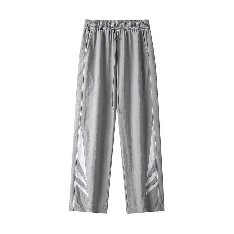 Men's black straight leg sports trousers with elastic waistband shown on hanger