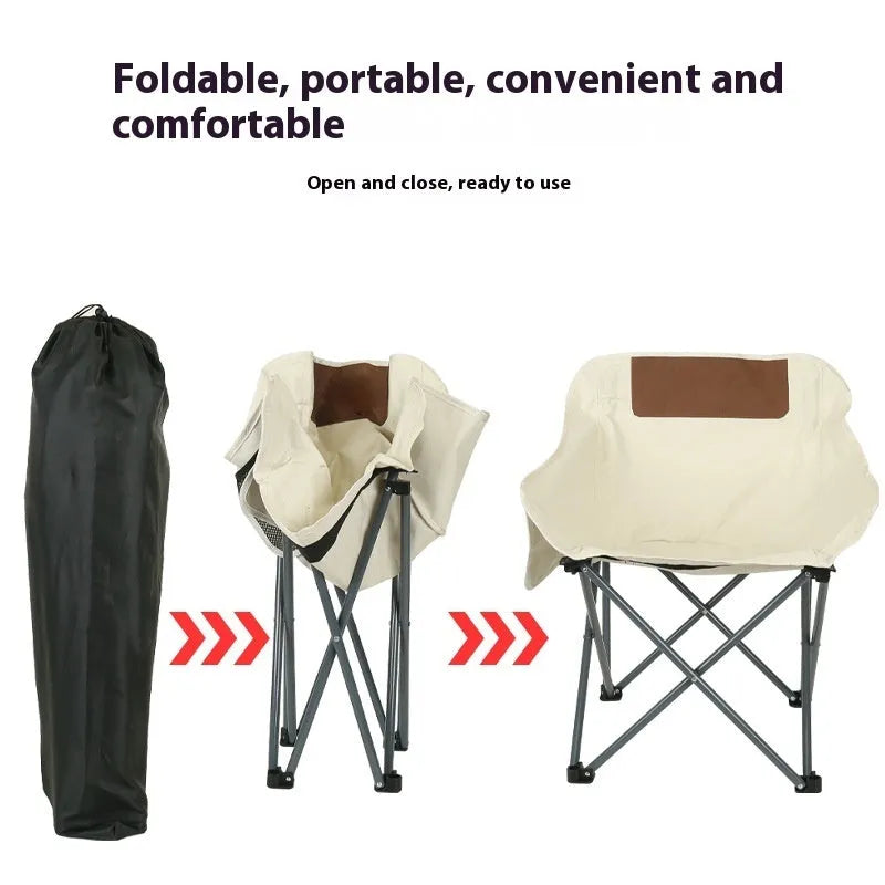 Beige folding camping chair with steel frame and Oxford cloth seat in outdoor setting