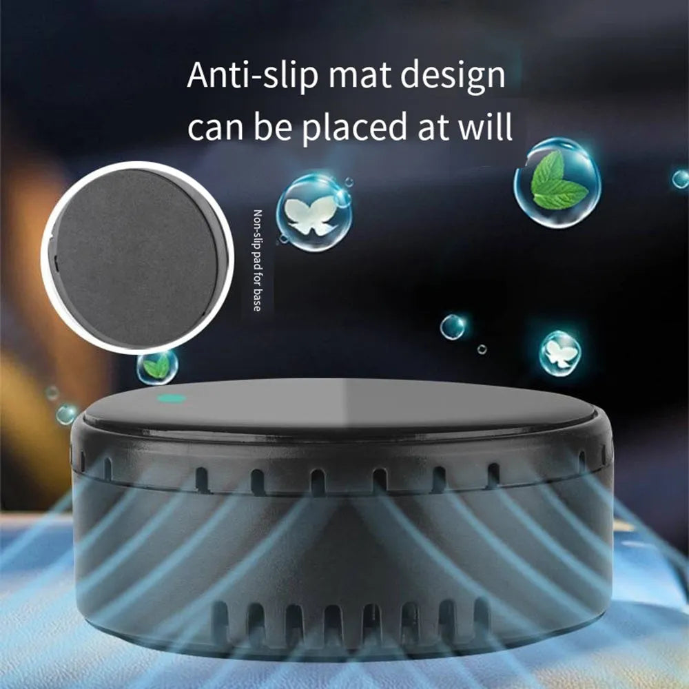 Black solar-powered car air humidifier mounted on a vehicle air vent.