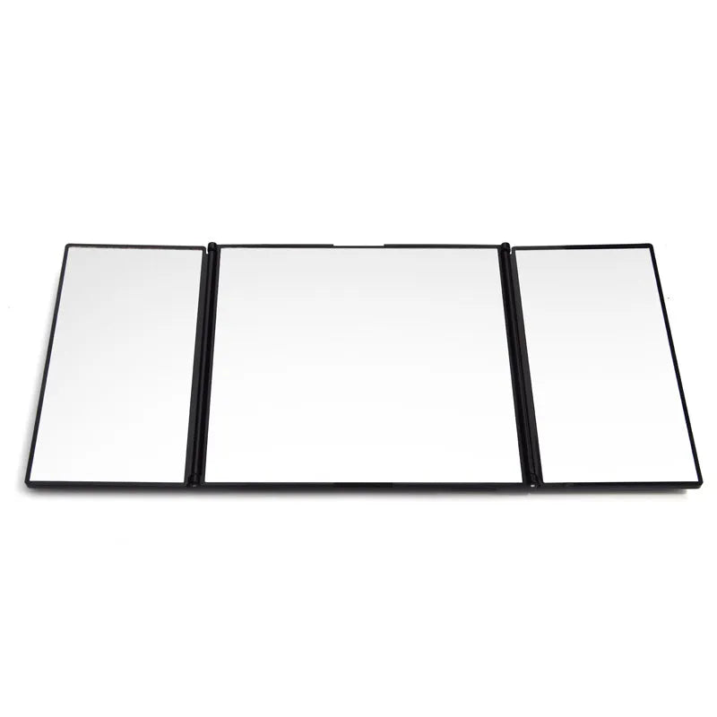 Silver car folding makeup mirror shown both closed and opened to show size difference