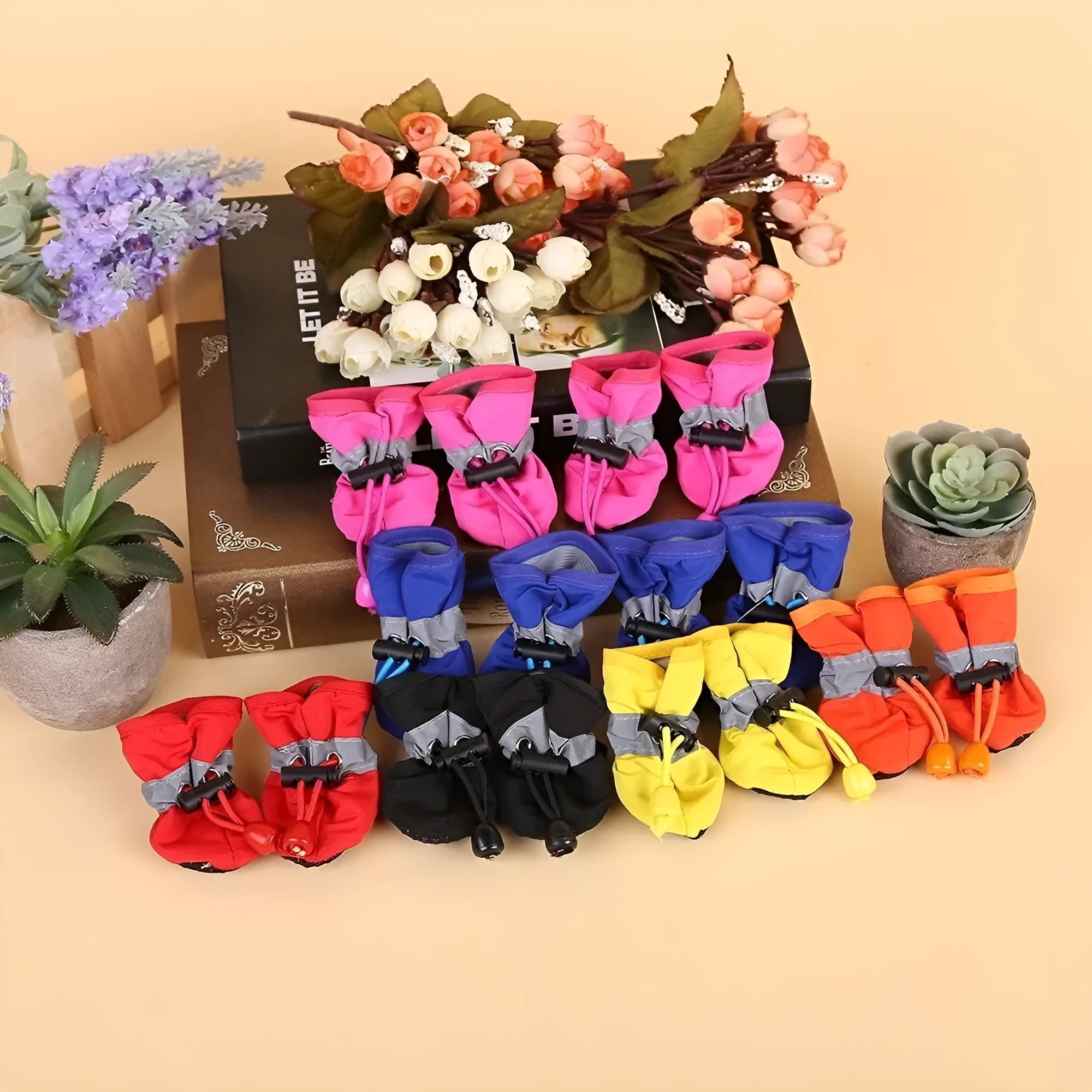 Set of four cloth dog shoes with soft soles in Rose Red colour showing non-slip bottoms