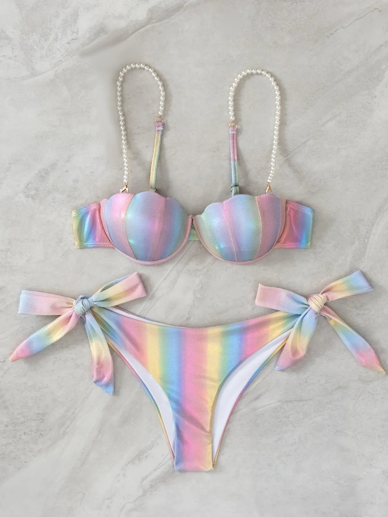 Women's rainbow split tied bikini swimsuit made from polyester fabric.