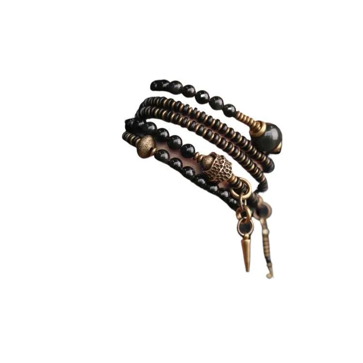 Geometric black beaded multi layered bracelet with natural styling elements