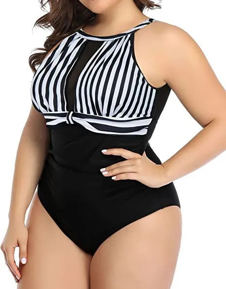 Women's black, striped, and red floral one-piece polyester swimsuit showing front view on mannequin.