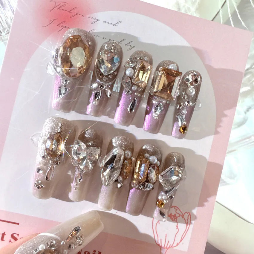 Rhinestone decorated false nail patches on card, with choice of jelly adhesive or tool set.