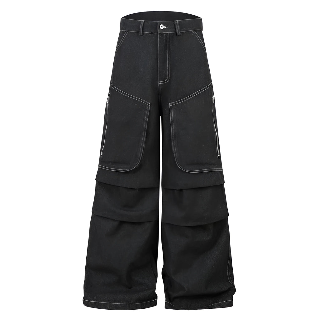 Black multi-pocket pleated workwear jeans made from cotton denim on a plain background.