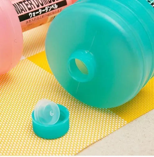 Water-filled fitness dumbbell for women in pink polypropylene plastic with leak-proof port