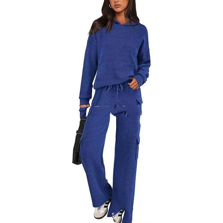 Women's polyester leisure sports suit in various colours showing long-sleeve top and matching trousers