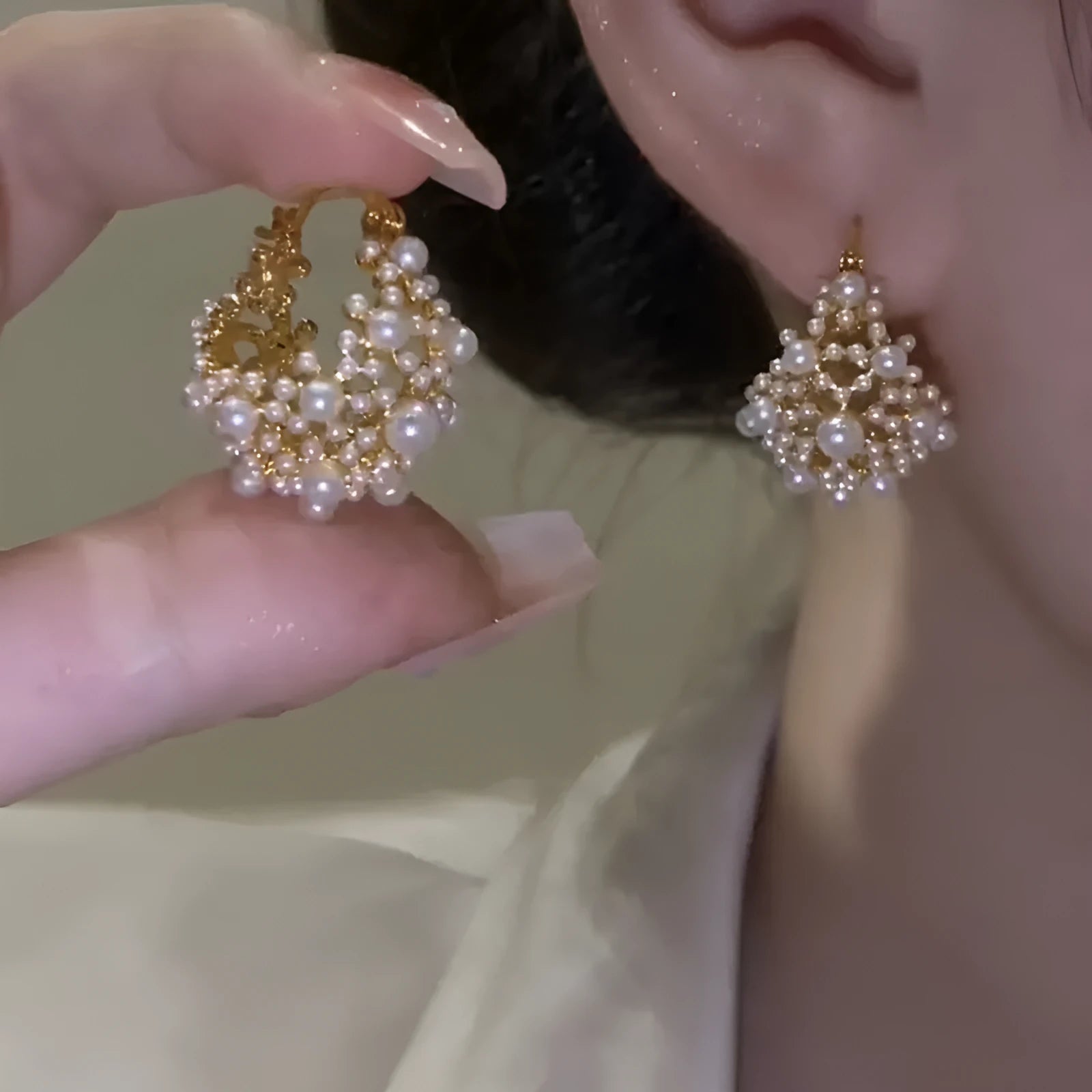 Gold-coloured copper flower basket earrings with rice-shaped bead inlay detail
