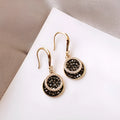 Black geometric round alloy earrings with 3.6cm drop length, retro Hong Kong style design