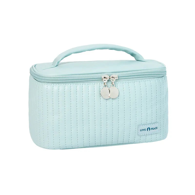 Open-top PU leather makeup bag in beige colour showing wide-mouth design for easy access