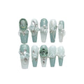 Full diamond camellia gradient nail armour set with bow and butterfly patterns in blush tones