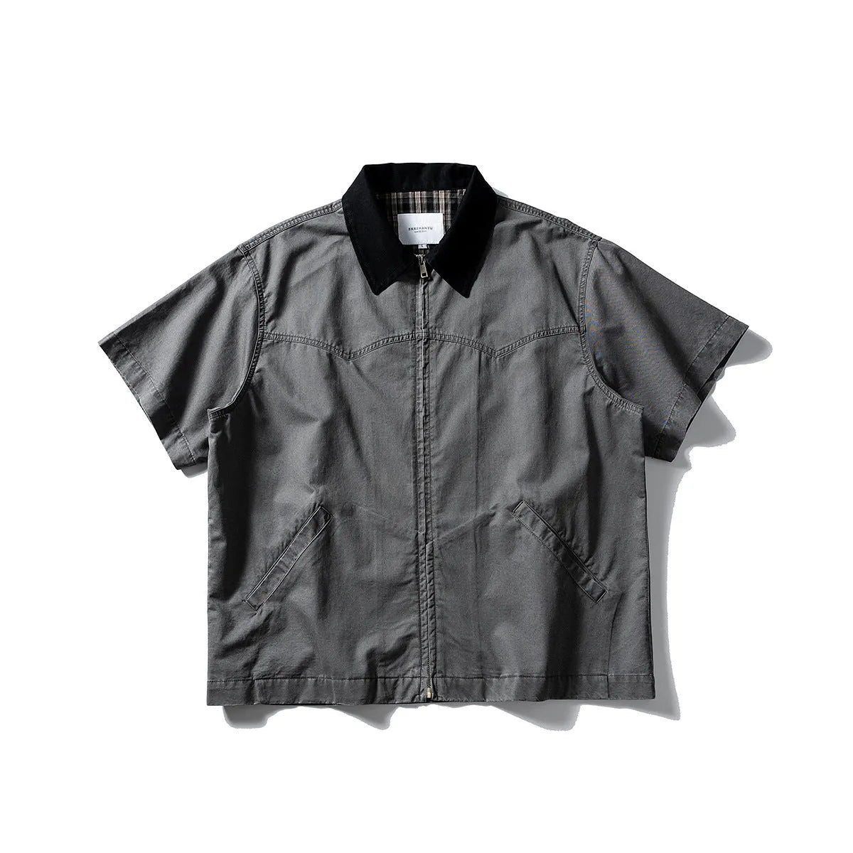 Short sleeve washed cotton overalls shirt in loose cardigan style, khaki colour, on hanger