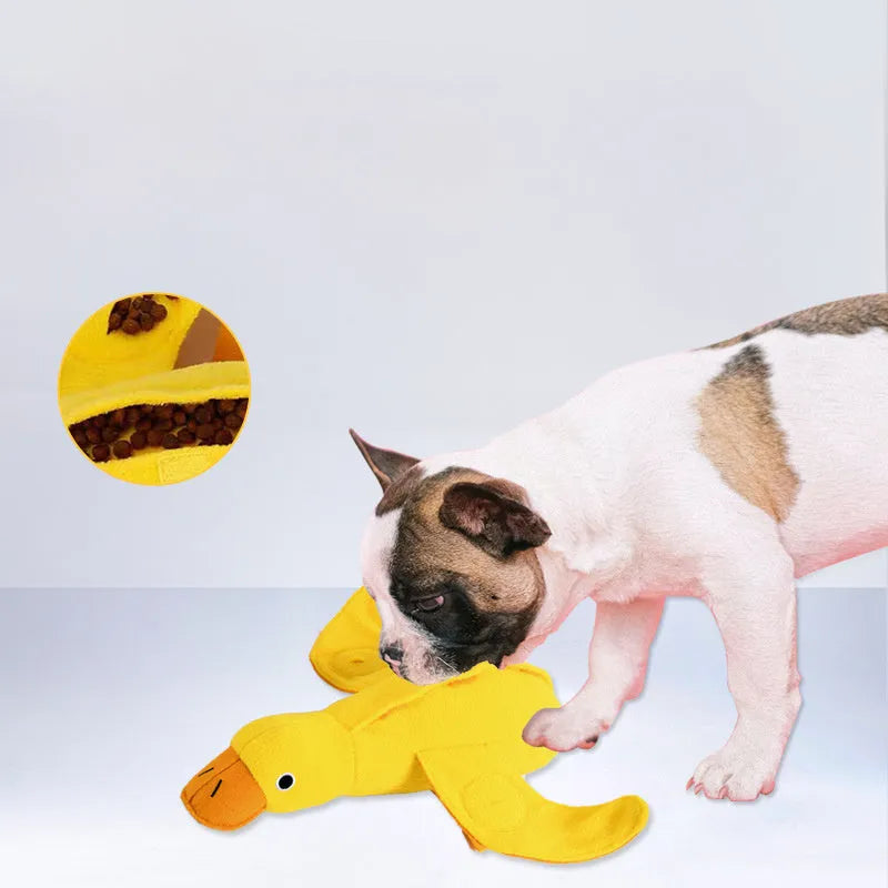 Yellow teddy dog training toy with integrated duck doll and food leak compartments