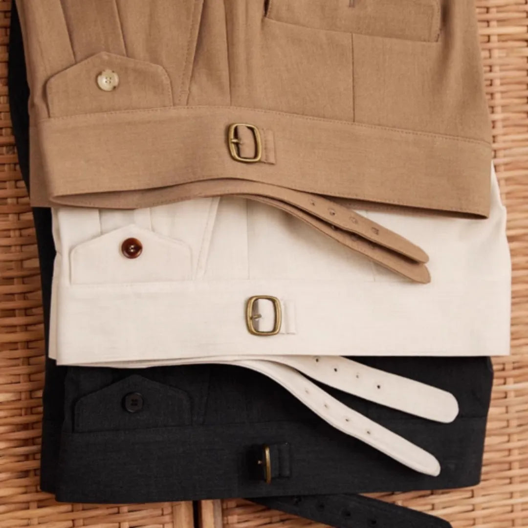 Men's slim fit straight leg business trousers in dark grey, shown in a professional setting.