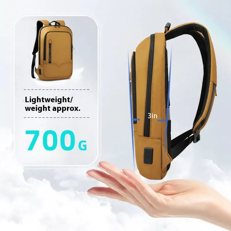 Lightweight orange polyester commuter backpack with USB charging port on the shoulder strap.