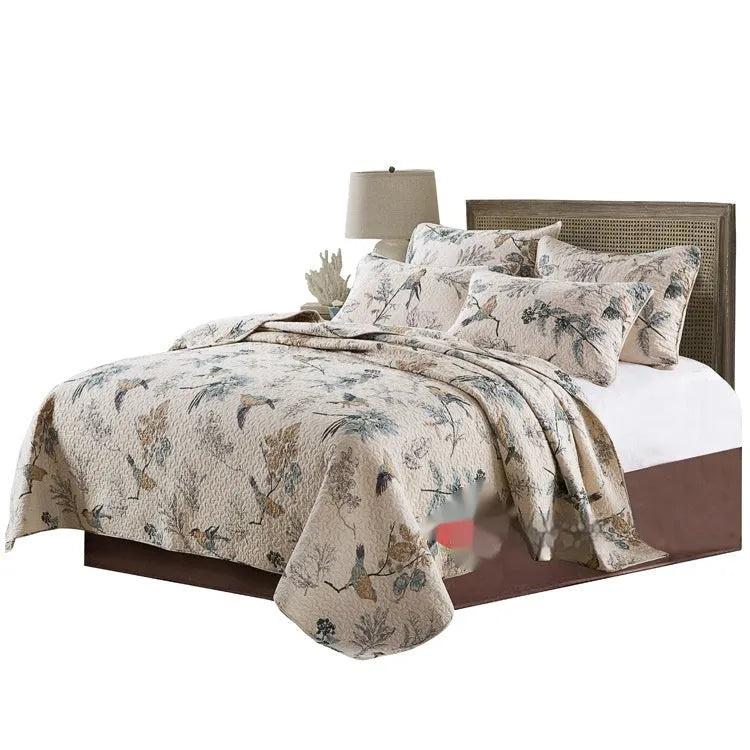 Quilted pure cotton bed cover set with two pillowcases in a colourful printed pattern.