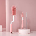 Silicone baby bottle brush with straw cleaning head in pink, blue or yellow colours