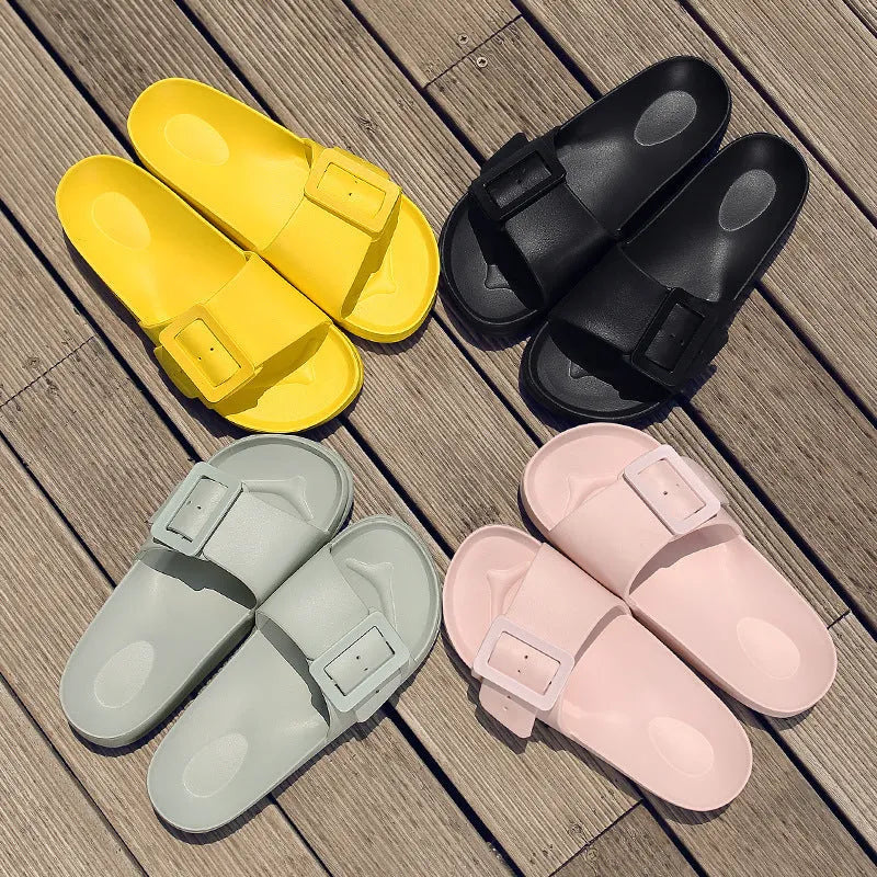 Women's grey blue buckle slippers with a soft EVA sole and single buckle closure.