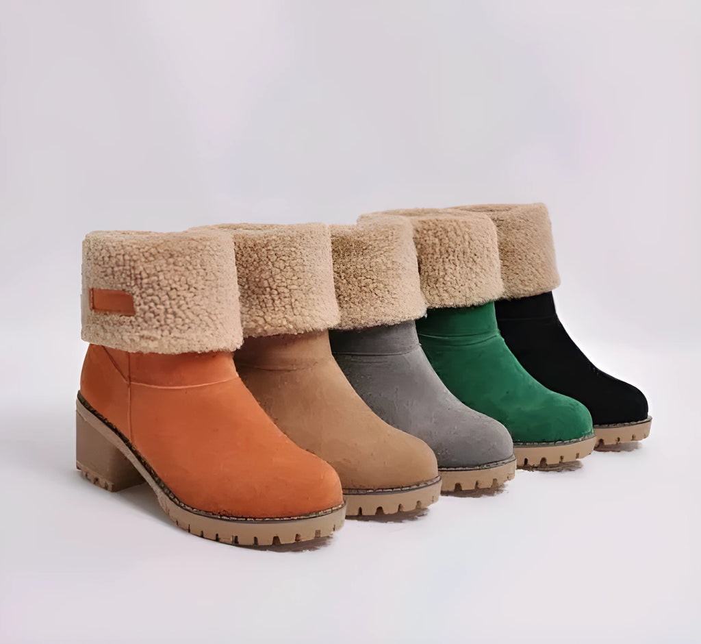 Women's suede mid-calf snow boot in grey with a flat heel and round toe.