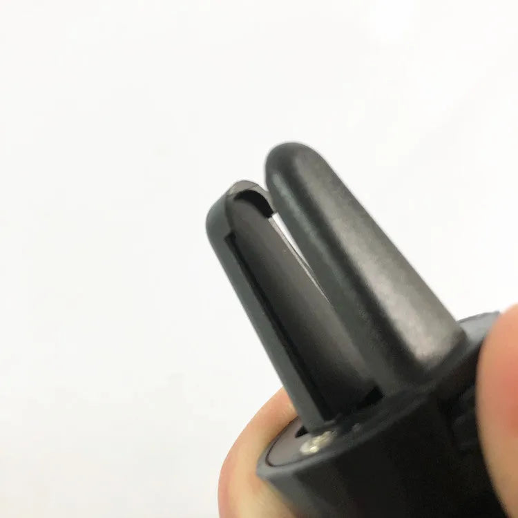 Glory Black car phone holder with adjustable clamp attached to a car air vent