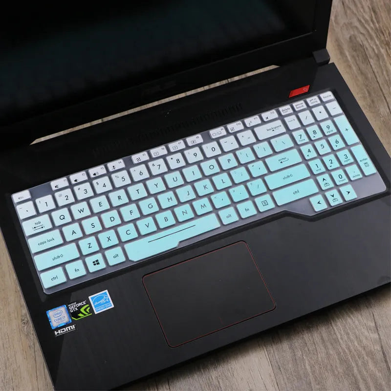 ASUS VivoBook 15 X513 laptop with a translucent mint coloured silicone keyboard protector fitted.