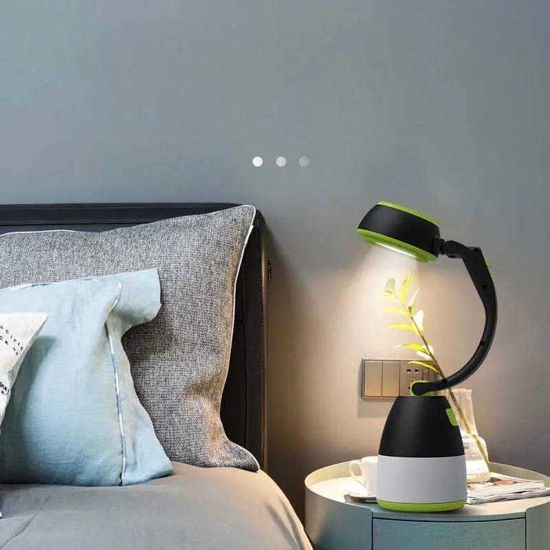 Black green multifunctional LED lamp with folding stand, shown in camping and desk use settings.
